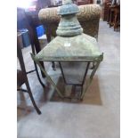 A copper Verdigris street lantern 32' high. Three glass panes lacking