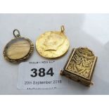 A Victorian yellow metal diptych locket, another locket and a gilt metal half-dollar