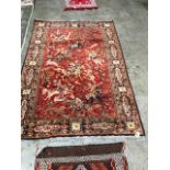 A red ground eastern rug