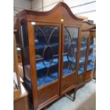 An Edward VII mahongany and line inlaid china cabinet enclosed by a pair of astragal glazed doors.