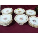 A Coalport part dessert service, painted with flower sprays, to comprise six comports (two