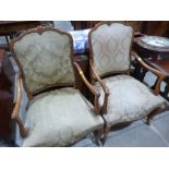 A pair of French elbow chairs