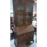 A 1930s oak bureau bookcase. 36' wide