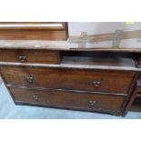 A mahogany chest with frieze drawer and recess over two long drawers