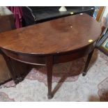 A George III mahogany gateleg supper table on square tapered legs with spade terminals. 48' wide