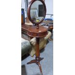 A Victorian mahogany shaving stand with telescopic mirror plate on baluster column and tripod