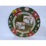 A Masons Ironstone charger, decorated in chinoiserie style with garden scenes in two reserves and
