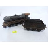 An early 20th century Bowman Models tinplate live steam locomotive and tender. The locomotive 12'