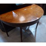 A George III mahogany demi-lune side table on square tapered legs. 44' wide