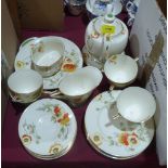 A Royal Doulton 'Poppies' tea service comprising 22 pieces