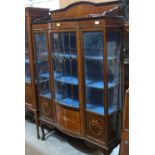 An Edward VII mahogany and line inlaid bow-breakfronted china cabinet enclosed by a leaded glazed