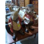 Two Beatrix Potter style resinous figures. 18' high