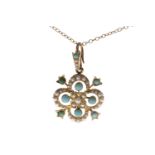 EDWARDIAN TURQUOISE AND PEARL PENDANT of quatrefoil form,