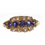 VICTORIAN SAPPHIRE AND DIAMOND RING with a rectangular bezel set with a central row of graduated