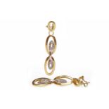 PAIR OF EIGHTEEN CARAT GOLD GEM SET EARRINGS formed by oval links set with round white gems,