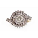 EIGHTEEN CARAT GOLD DIAMOND CLUSTER RING the round bezel set with a central round brilliant cut