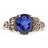 IMPRESSIVE MID TWENTIETH CENTURY SAPPHIRE AND DIAMOND RING set with a central oval sapphire 9mm