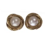 PAIR OF NINE CARAT GOLD MOUNTED PEARL STUD EARRINGS each with a spherical white pearl 6.