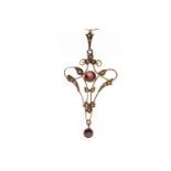 EDWARDIAN GARNET AND SEED PEARL PENDANT openwork and of sinuous form,