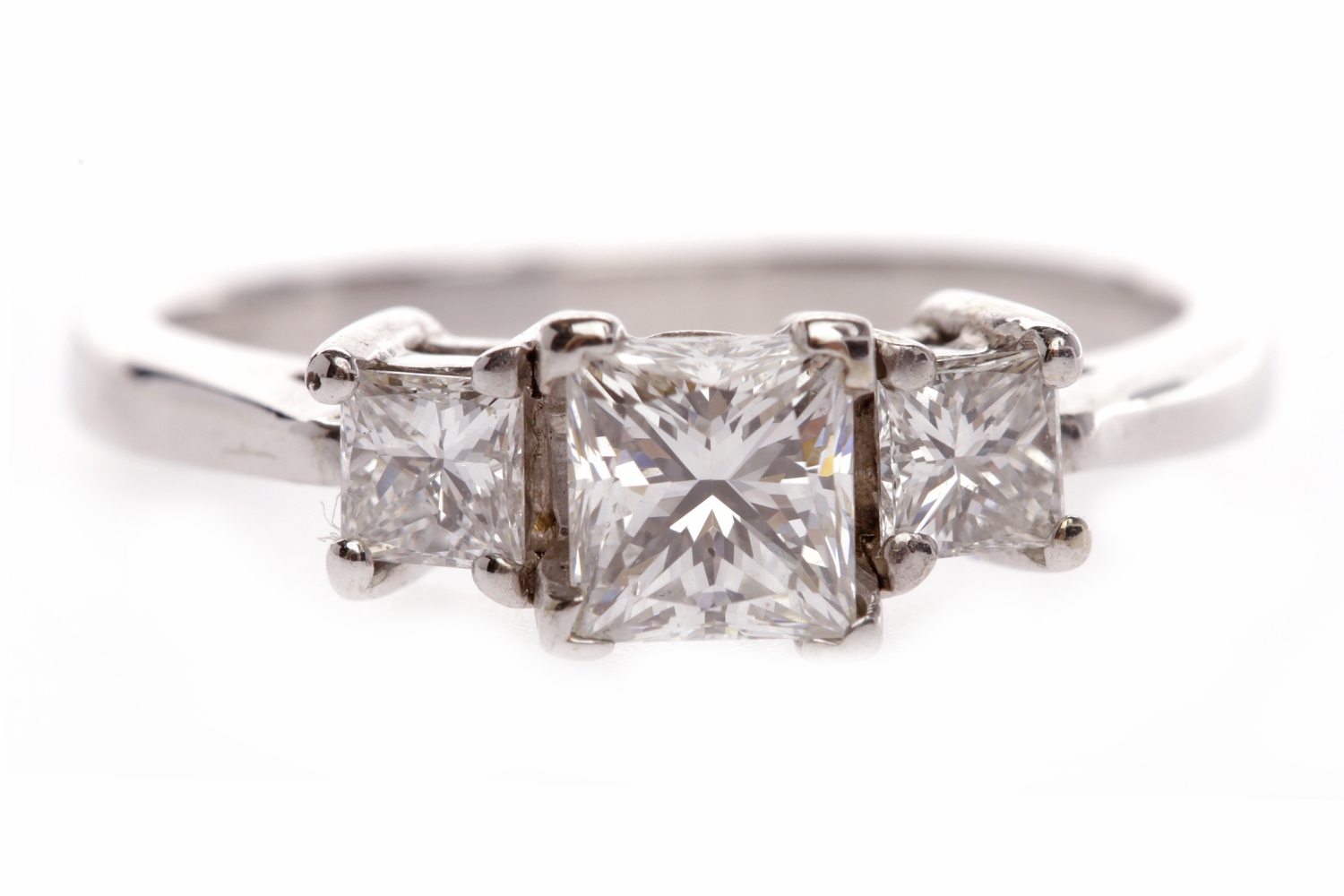 DIAMOND THREE STONE RING the central princess cut diamond of approximately 0.