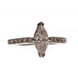 PLATINUM DIAMOND SOLITAIRE RING the central marquise cut stone of 0.