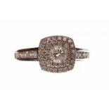 EIGHTEEN CARAT WHITE GOLD DIAMOND CLUSTER RING with a square bezel set with a central round