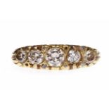 EIGHTEEN CARAT GOLD DIAMOND FIVE STONE RING the boat shaped bezel set with five graduated round