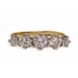 DIAMOND FIVE STONE RING the central round brilliant cut stone of approximately 0.