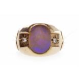 GENTLEMAN'S UNMARKED GOLD SIGNET RING set cabouchon Australian opal flanked by two diamond chips,