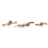 THREE VICTORIAN BAR BROOCHES comprising a fifteen carat gold garnet and pearl set floral motif bar