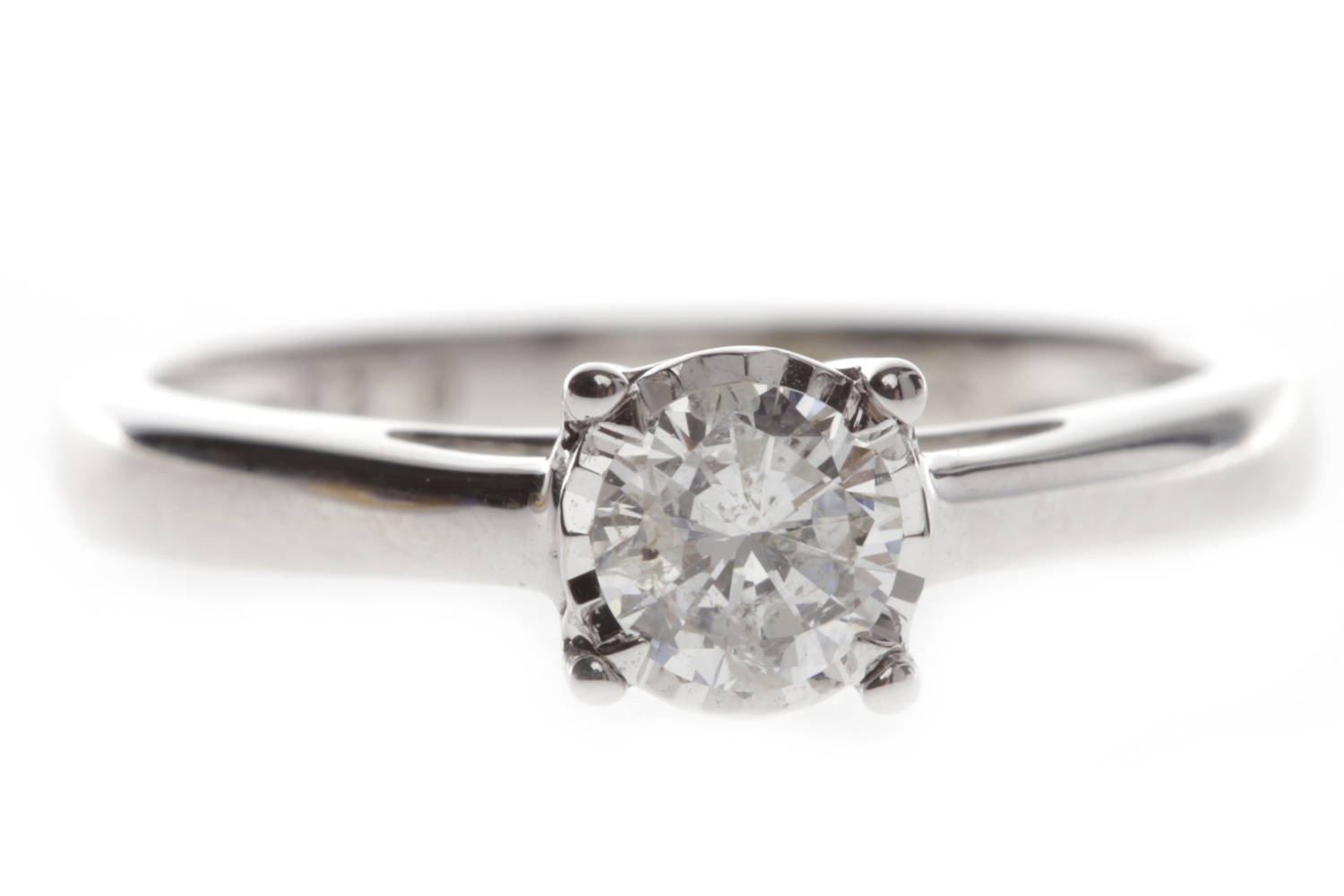 NINE CARAT WHITE GOLD DIAMOND SOLITAIRE RING with an illusion set round brilliant cut diamond of