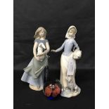 TWO NAO FIGURES OF YOUNG GIRLS along with a glass paperweight