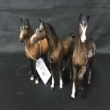 THREE BESWICK FIGURES OF HORSES