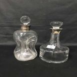 TWO SILVER COLLARED DECANTERS along with a silver mounted ewer and a Sevres glass table lamp