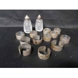 LOT OF INDIAN WHITE METAL NAPKIN HOLDERS along with silver plate and crystal salt and pepper