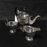 SILVER PATED THREE PIECE TEA SET and a canteen of silver plated cutlery