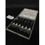 CASE SET OF SIX SILVER SPOONS with crossed golf club terminals;