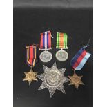 GROUP OF FOUR WWII SERVICE MEDALS awarded to Mr J Muir and a silver Forrester star