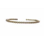 EIGHTEEN CARAT GOLD DIAMOND SET BANGLE