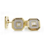 PAIR OF DIAMOND SET BI COLOUR CUFF LINKS each of octagonal form and with a single yellow metal