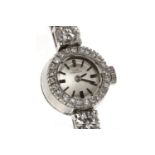 LADY'S GIRARD PERREGAUX EIGHTEEN CARAT WHITE GOLD DIAMOND SET MANUAL WIND COCKTAIL WATCH the round