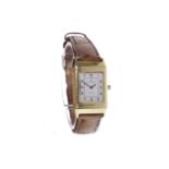 LADY'S JAEGER LE COULTRE REVERSO EIGHTEEN CARAT GOLD WRIST WATCH the rectangular silver-coloured