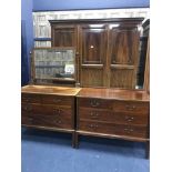 BEDROOM SUITE comprising a large mahogany three door wardrobe,