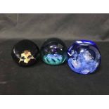 THREE CAITHNESS PAPERWEIGHTS comprising dewdrop orchid,