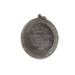 LATE VICTORIAN CURLING MEDAL the white metal circular panel cast in relief with a male figure