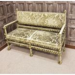 SQUARE BACK TWO SEAT SETTEE OF 17TH CENTURY DESIGN upholstered in tasselled green velvet,