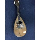 EARLY 20TH CENTURY ITALIAN MANDOLIN inset with mother of pearl and with a label to the interior