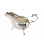 LARGE SILVER SAUCE BOAT OF GEORGE III DESIGN maker Walker & Hall, Sheffield 1913, of rounded form,