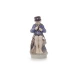 ROYAL COPENHAGEN FIGURE OF A BOY model 905, modelled sat on a rock whittling,