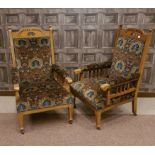 ATTRACTIVE PAIR OF LATE VICTORIAN OAK OPEN ARM CHAIRS OF ART & CRAFTS DESIGN the arched top rail